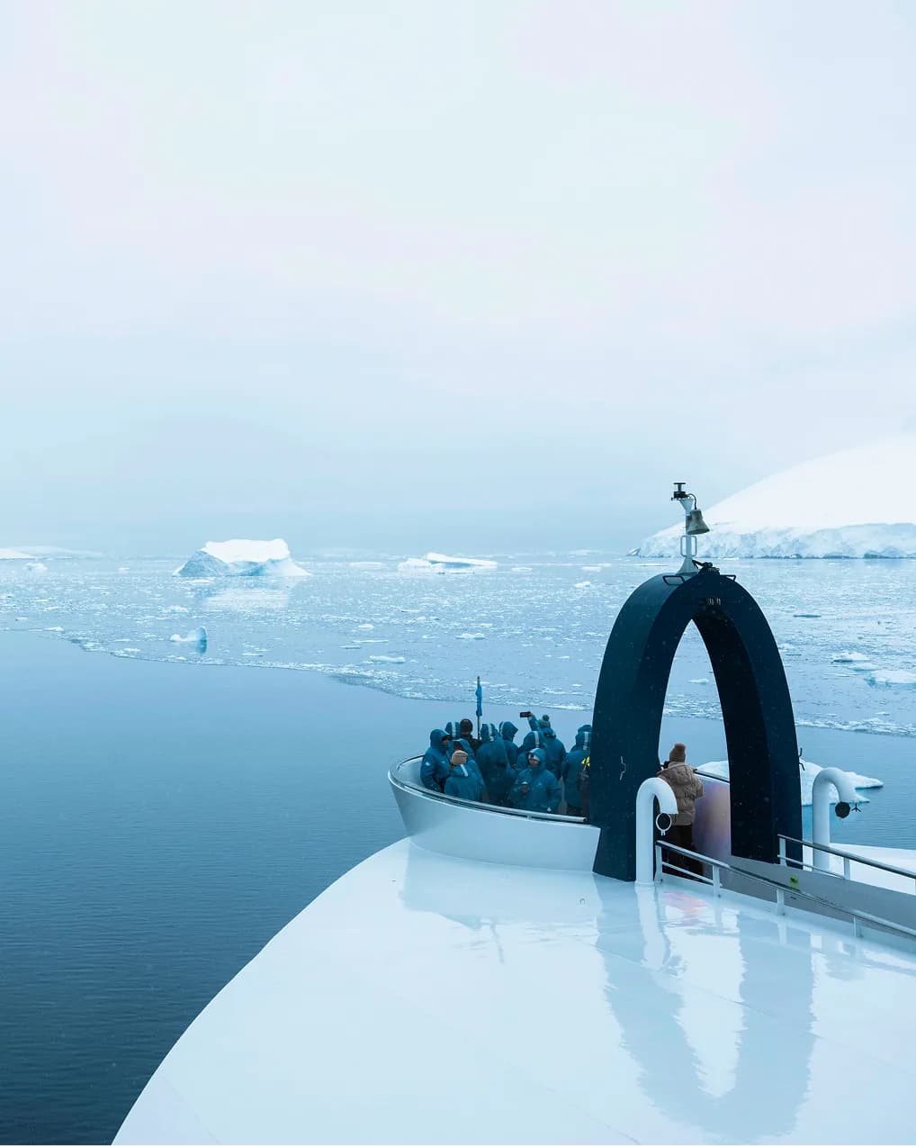 Guests gathered on the bow as the ship crosses sea ice