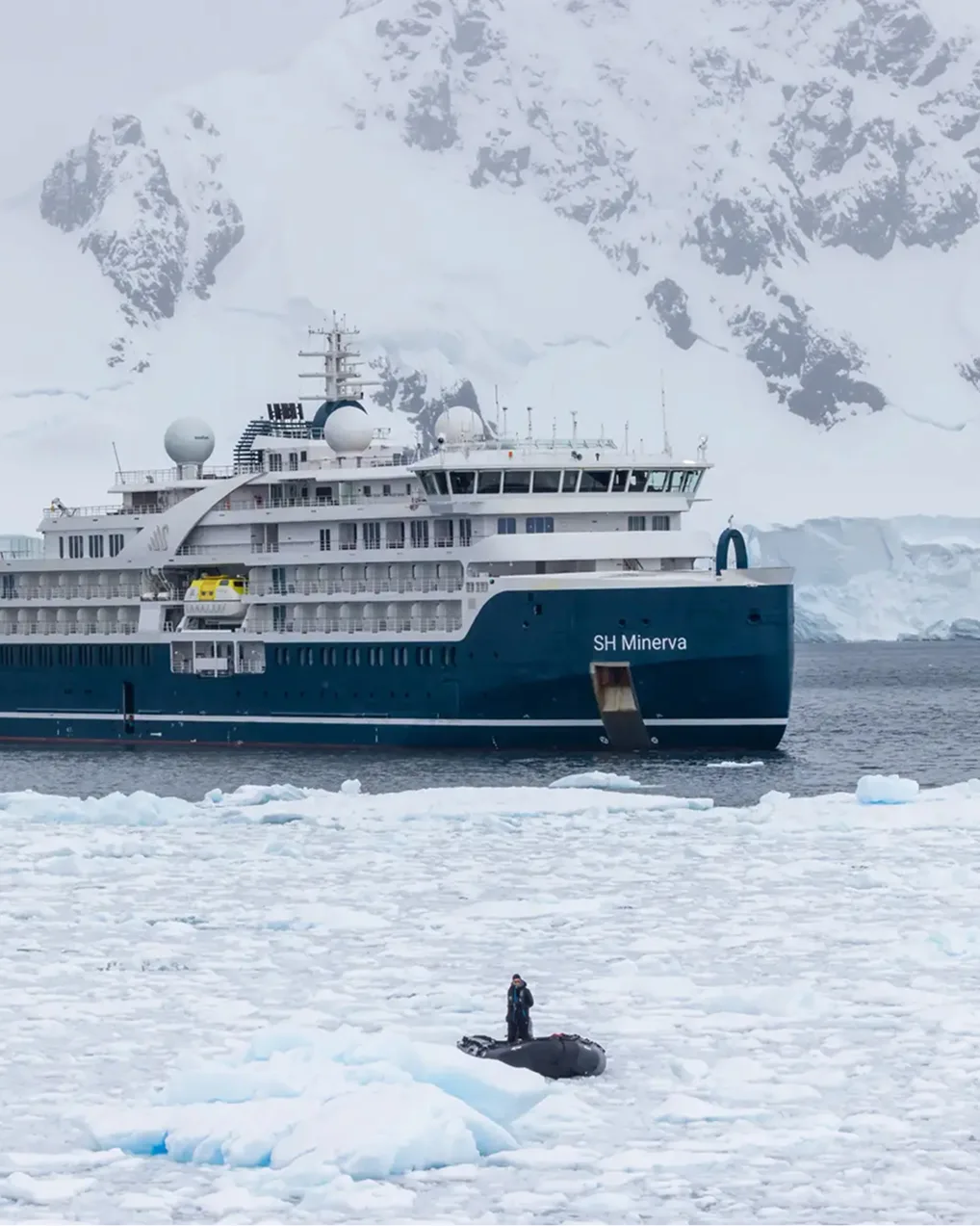 SH Minerva among brash ice below an Antarctic glacier