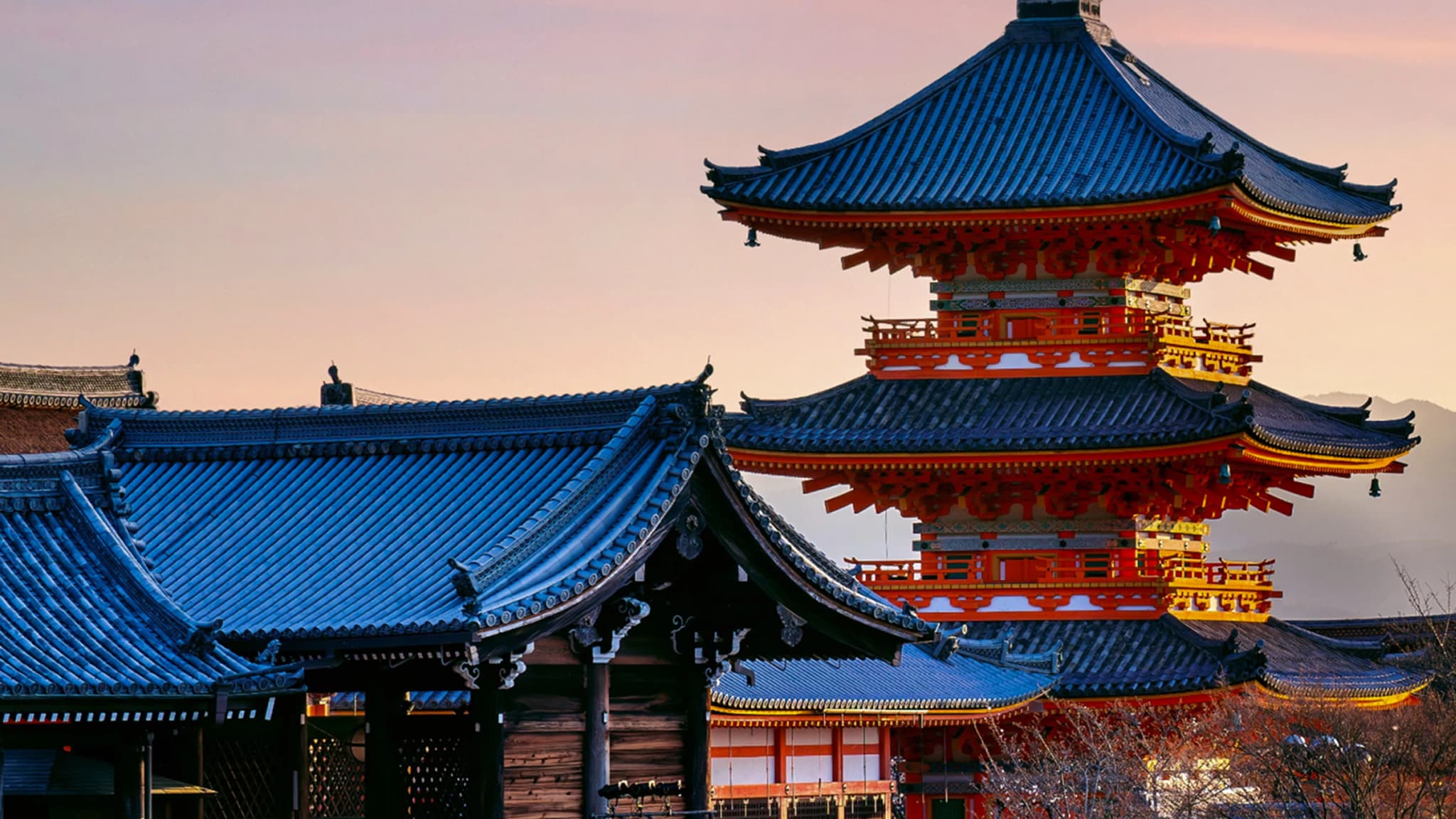 Japanese pagoda and temple roofs at sunset