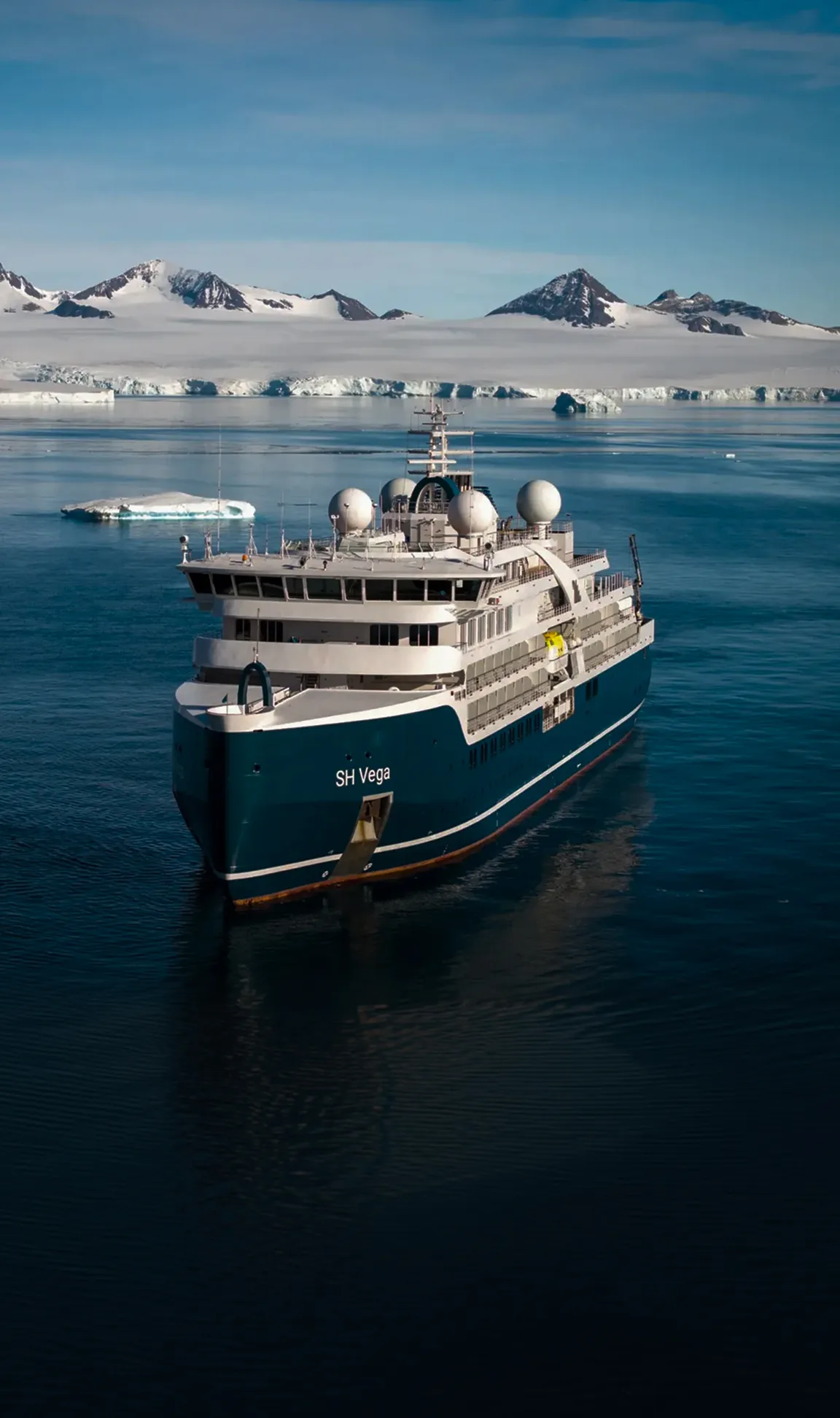 SH Vega in polar waters below a glacier front